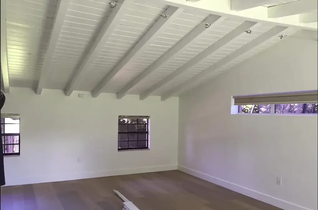 Freshly painted interior with vaulted white ceiling mid-project