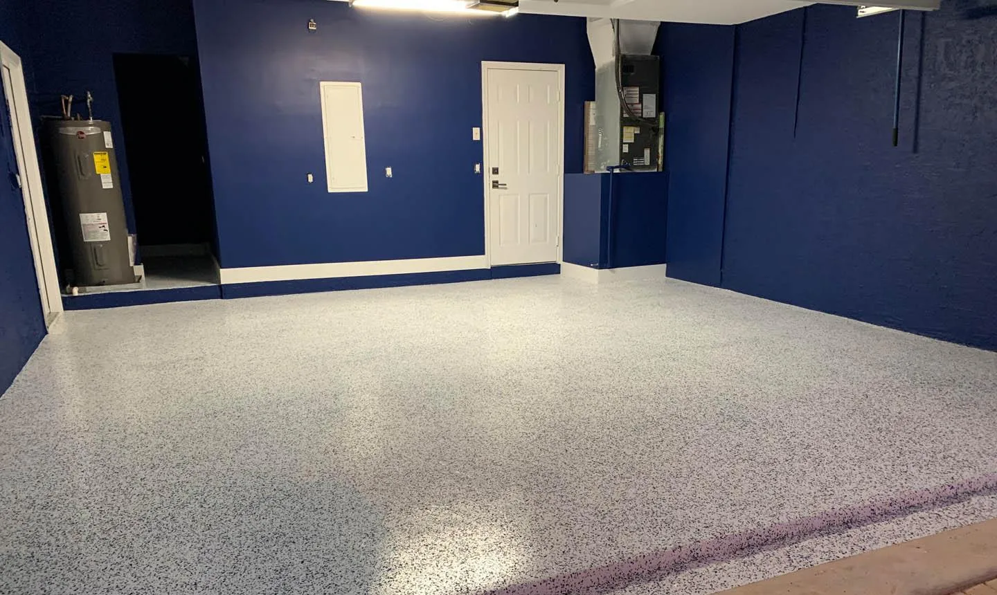 Garage with new flake floor coating and deep blue walls